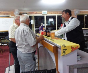 Enjoying conversation with the bar attendant. Cheers!